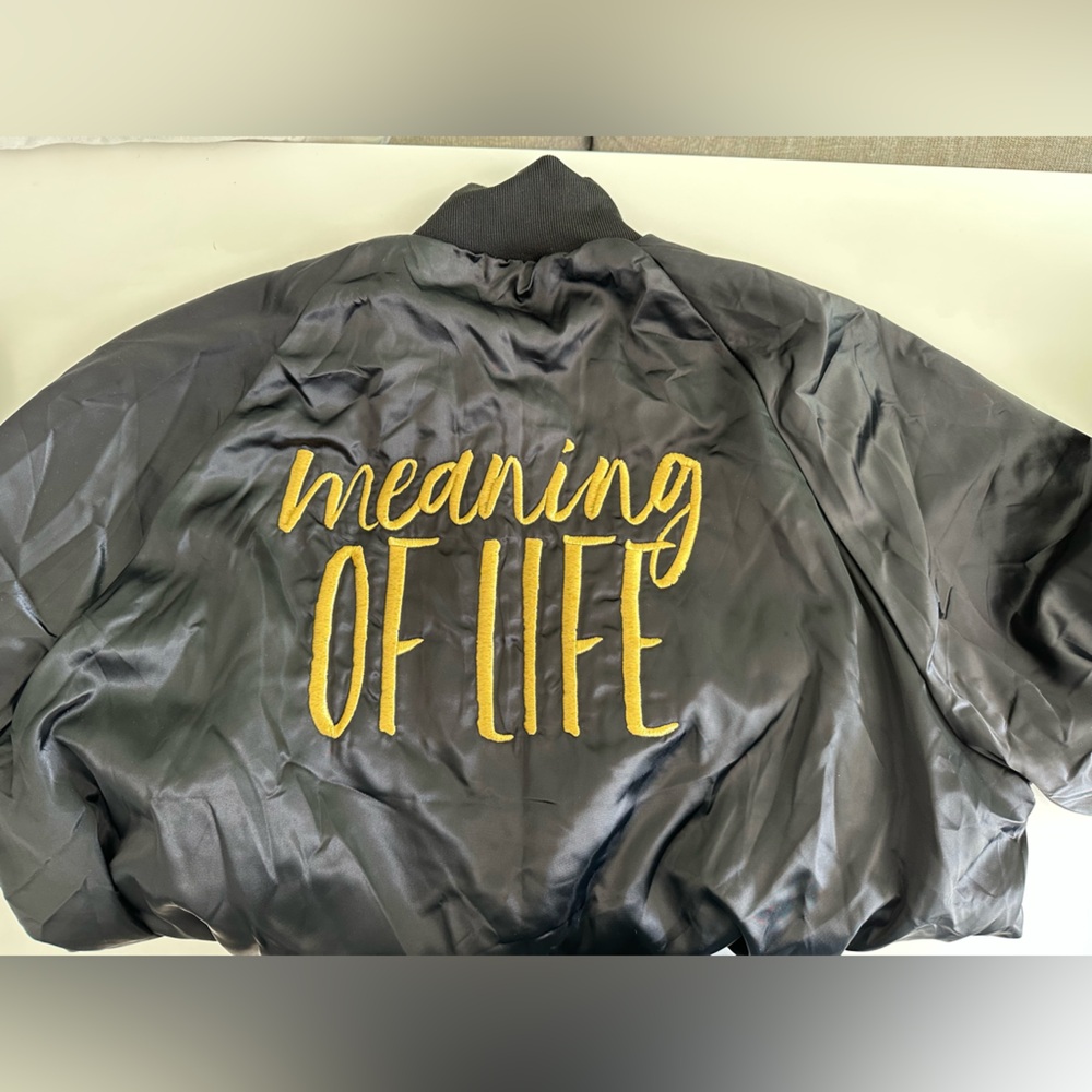 Kelly Clarkson Black bomber jacket with "Meaning Of Life"